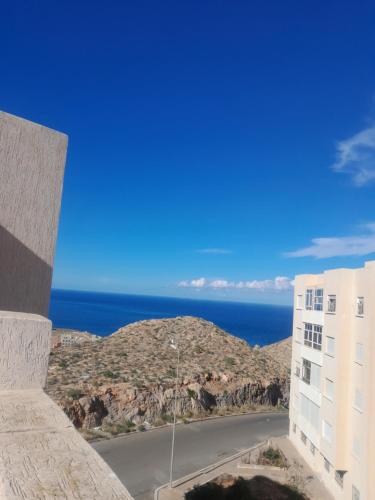 a view of the ocean from a building at Appartement Familial Al Hoceima WiFi in Al Hoceïma