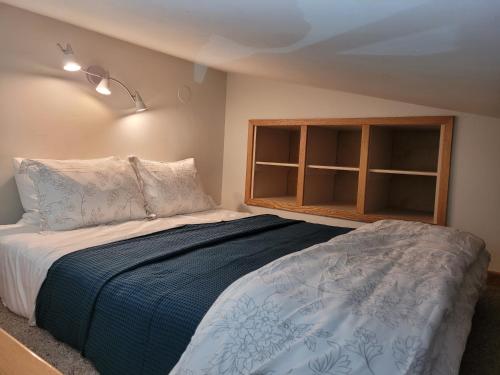 a bedroom with a bed and a window at Quiet Lofted Studio at Tomboy Lodge in Telluride