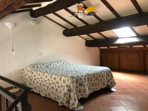 a bedroom with a bed and a ceiling at L'Orbetellana - Guest House in Orbetello