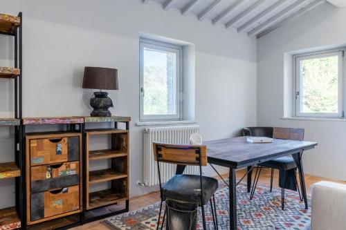 a dining room with a table and chairs at CASALE ORTALI by Miani Group in Pesciano