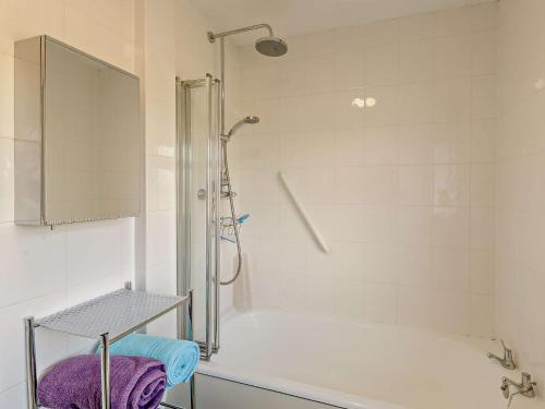a white bathroom with a tub and a shower at 2 Bed in Sawmills PK934 in Whatstandwell