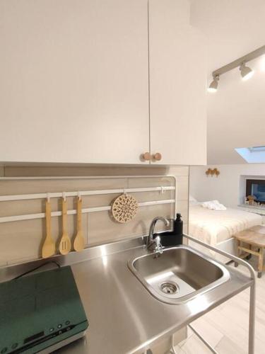 a kitchen with a sink and a counter top at Di Finizio_Cottage in Barrea