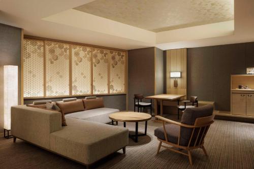 a living room with a couch and a table at Nagoya Marriott Associa Hotel in Nagoya
