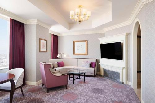 a living room with a couch and a tv at Nagoya Marriott Associa Hotel in Nagoya