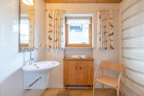 a bathroom with a sink and a window at Haus in den Wiesen in Burgberg