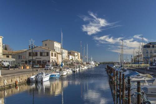 a group of boats are docked in a marina at Mazet NiMiSa in Marseillan