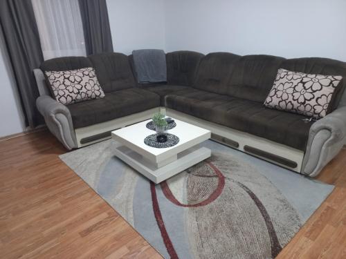 a living room with a couch and a coffee table at Apartman Diva in Belgrade