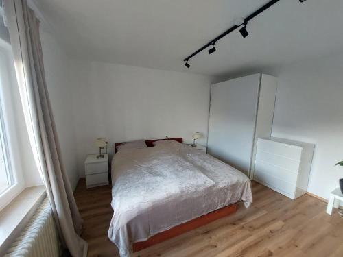 Cama ou camas em um quarto em Moskriceva Apartment