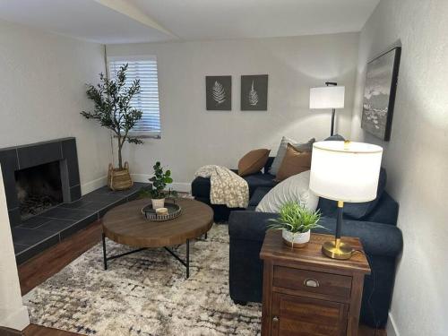 a living room with a blue couch and a fireplace at Cozy Mountain Escape in Salt Lake City