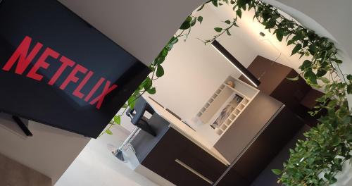 a sign that says netflix next to a house at Unique New Apartment - Victoria - Gozo in Victoria