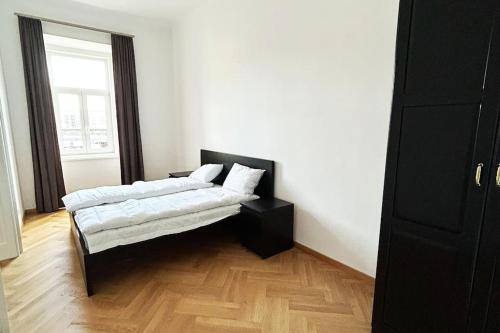 Posteľ alebo postele v izbe v ubytovaní Prater City Apartment