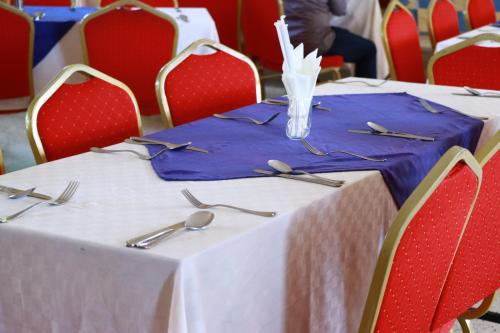 a table with forks and spoons on top at YAYANI GATE B in Nairobi