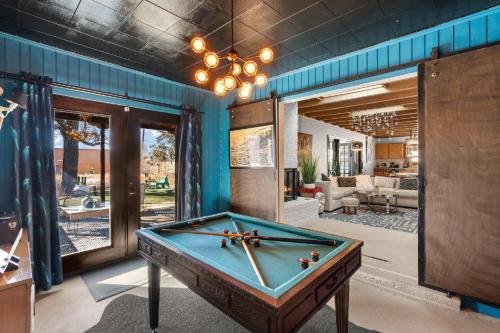 a pool table in the middle of a room at Casa de La Rosa in Santa Fe NM in Santa Fe