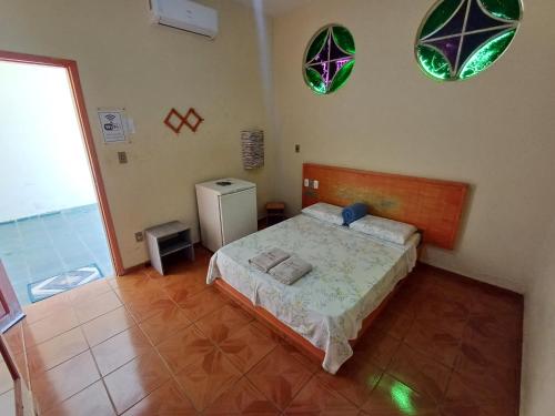 Hotel Mar de Minas tesisinde bir odada yatak veya yataklar