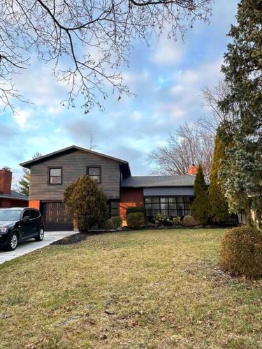 a house with a car parked in front of it at Vacation paradise in St. Catharines