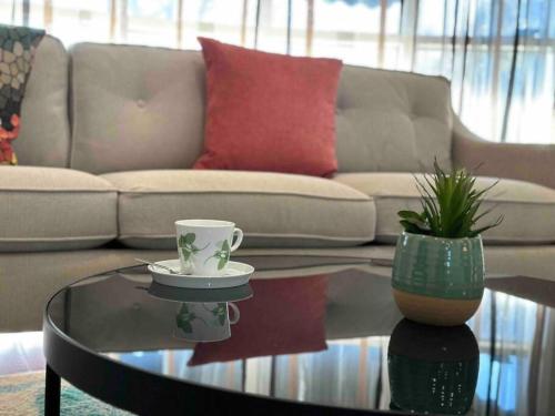 a living room with a coffee table and a couch at Vacation paradise in St. Catharines