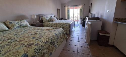 Tempat tidur dalam kamar di Goistay Oasis Juan Dolio,escapada Sonada Te Espera