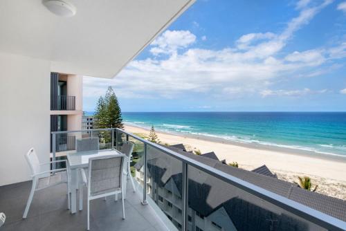 a balcony with a view of the beach at Ocean Views Apartment with Rooftop Pool - CoastHM in Gold Coast