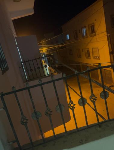a view from a balcony of a building at night at Residence Mouna in Nouadhibou