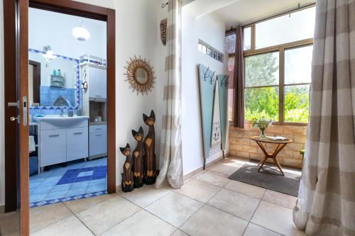A bathroom at Domo Anghèleda - Alghero casa indipendente vicino al mare