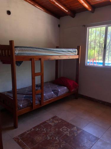 a bedroom with two bunk beds in a room with a window at La Gallega in San Javier