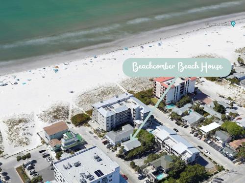 an aerial view of a beach with condos at Beachcomber Beach House - Weekly Rental Just Steps to White Sand Beach! home in Clearwater Beach