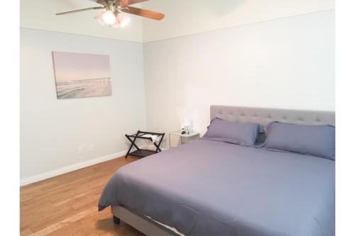 a bedroom with a bed and a ceiling fan at Enjoy Fruits Of Your Labours At Grape Dr- View 3D in Las Vegas