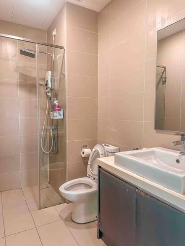 a bathroom with a shower and a toilet and a sink at [Starry x GREEN @GreenHaven]3Beds2Bath in Masai