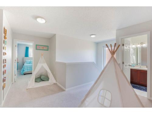 a room with a play room with a play tent at Themed 6BD Home with Pool - Near Orlando Attractions in Kissimmee