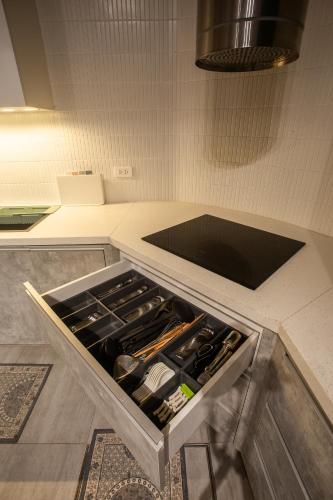 a kitchen with an open drawer in a counter at Lanha Hotel - Homestay in Hanoi