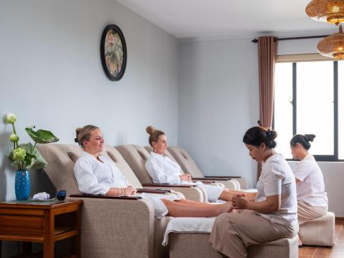 a group of women sitting in a waiting room at Shining Riverside Hoi An Boutique & Spa in Hoi An