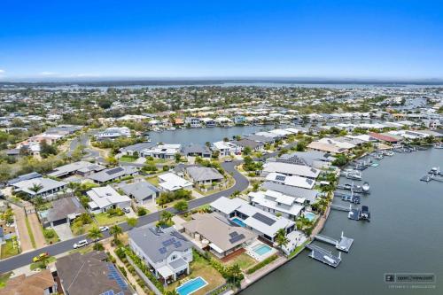 an aerial view of a harbor with houses at New Haven - Grand Canal View Suite in Banksia Beach