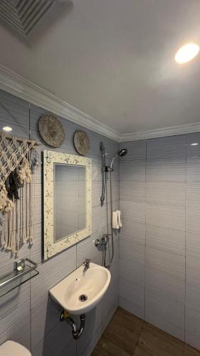 a bathroom with a sink and a mirror at La village hills view in Nusa Penida