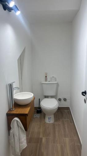 a bathroom with a white toilet and a sink at Duplex alquiler Mar del Plata in Mar del Plata