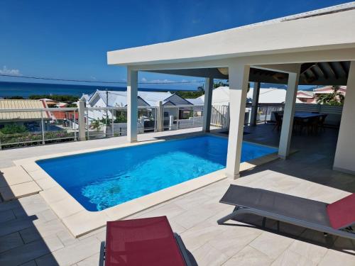 a swimming pool on top of a house at Villa Corazon in Sainte-Luce