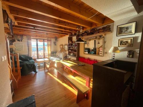 a living room with a couch and a table at Duplex 3 pièces + cabine avec balcon et parking au centre des Angles - FR-1-593-102 in Les Angles