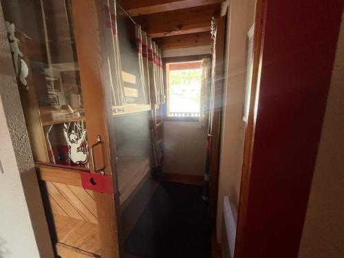 a hallway of a tiny house with a window at Duplex 3 pièces + cabine avec balcon et parking au centre des Angles - FR-1-593-102 in Les Angles