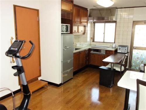 a kitchen with a camera in a room at Corpo Umeyama 2F / Vacation STAY 3912 in Mibu