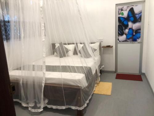 Postel nebo postele na pokoji v ubytování Green House Ahangama