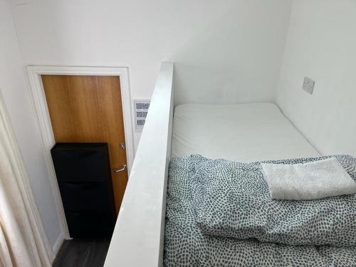 a bedroom with a bunk bed and a door at City Centre 4 in Manchester