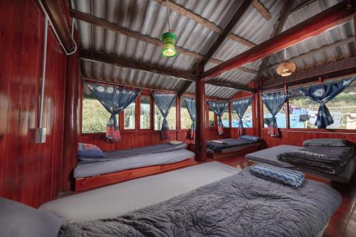 a bedroom with two beds in a train car at Zili Homestay in Sa Pa