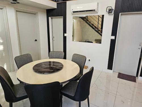 a meeting room with a table and chairs at Arte Cheras The Premium Suites by iLuxHome in Kuala Lumpur