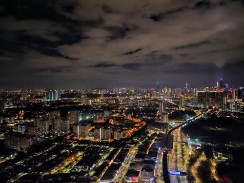 a city lit up at night with cars at Arte Cheras The Premium Suites by iLuxHome in Kuala Lumpur