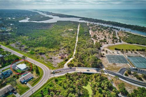 an aerial view of a road and a river at New Beach Cabana with Mini Golf in Venice