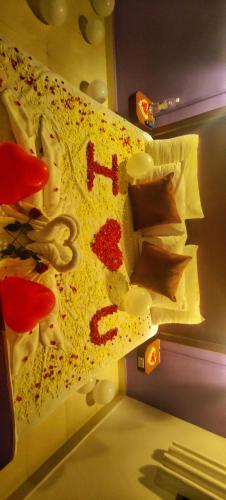 a bed with some paint and scissors on it at Vintage Beach Resort in Agonda