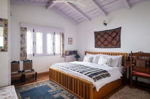 a bedroom with a large bed in a room at The White Peaks in Nainital