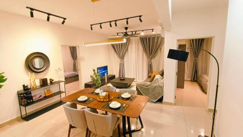 a living room with a table and a couch at Kulai d'putra suites beside ioiMall near Airport and JPO in Kulai
