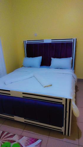 a large bed in a room with at Nabbynates bnbs in Eldoret