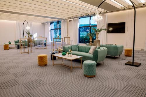 a living room with a couch and a table at W Costa Navarino in Pylos