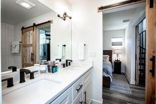 a bathroom with a sink and a mirror at Mountain View Chalet at The Quarry - Sleeps 6! in Whitefish